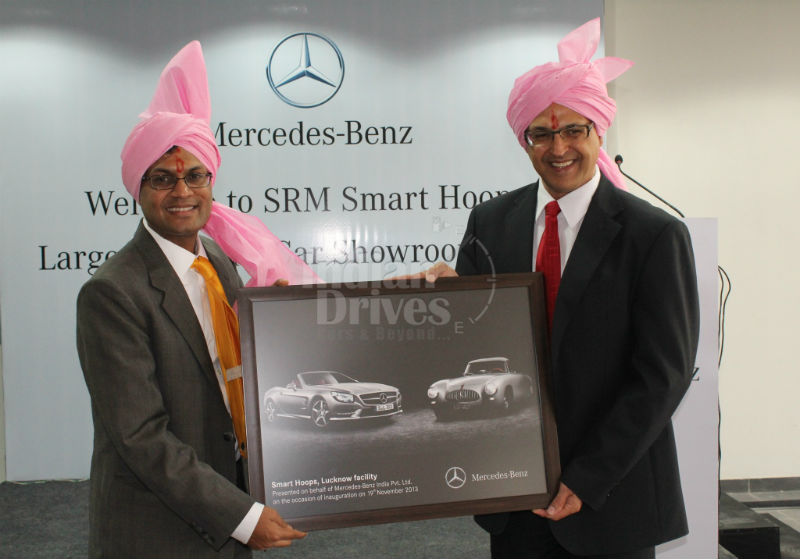 Eberhard Kern MD&CEO Mercedes-Benz India handing over the Dealer Memento to Neeraj Agarwal Managing Director SRM Smart Hoop