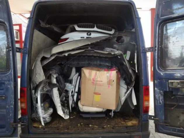 BMW X6 inside a Volkswagen LT van